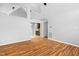 Open concept living room with hardwood floors and views of the kitchen at 809 Handel Ln, Apex, NC 27502