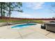 Refreshing backyard pool featuring an expansive patio and mature trees for privacy and shade at 809 Handel Ln, Apex, NC 27502