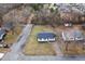 Aerial view of a single-story home showcasing its location and surrounding neighborhood at 825 Parkwood St, Burlington, NC 27215