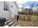 Back entrance featuring stairs and a white wooden handrail at 825 Parkwood St, Burlington, NC 27215