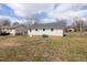 Spacious backyard with lush lawn and views of the surrounding neighborhood at 825 Parkwood St, Burlington, NC 27215