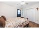 Cozy bedroom featuring hardwood floors, a ceiling fan, and a spacious closet at 825 Parkwood St, Burlington, NC 27215
