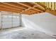 Clean, empty garage with a large roll-up door, ready for vehicle or storage use at 8310 Hempshire Pl # 106, Raleigh, NC 27613