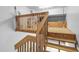 Spacious garage featuring a custom wooden storage platform with staircase access at 8310 Hempshire Pl # 106, Raleigh, NC 27613