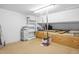 Functional garage space with custom plywood storage and shelving units at 8310 Hempshire Pl # 106, Raleigh, NC 27613