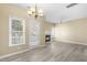 Bright living area with hardwood floors, fireplace, and direct access to outdoor space at 8310 Hempshire Pl # 106, Raleigh, NC 27613