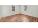 Bright bedroom with hardwood floors and two windows offering plenty of natural light at 916 Tyan St St, Rocky Mount, NC 27801
