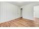 Charming bedroom featuring stylish wainscoting and hardwood floors at 916 Tyan St St, Rocky Mount, NC 27801