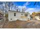 A charming one-story home with a brick chimney and freshly painted white exterior at 916 Tyan St St, Rocky Mount, NC 27801