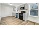 Bright kitchen with updated appliances, light cabinets, and a stylish backsplash at 916 Tyan St St, Rocky Mount, NC 27801