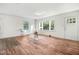 Open concept living room featuring hardwood floors and multiple windows at 916 Tyan St St, Rocky Mount, NC 27801