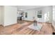 Open concept living room featuring hardwood floors with view into the kitchen at 916 Tyan St St, Rocky Mount, NC 27801