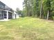 A newly sodded backyard with a border of trees at 9160 Dupree Meadow Dr # 13, Angier, NC 27501