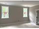 Bedroom showing new construction with lots of light coming through two windows at 9160 Dupree Meadow Dr # 13, Angier, NC 27501