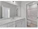 Clean bathroom featuring double vanity, bright lighting and a tub-shower combination with neutral finishes at 9168 Dupree Meadow Dr # 15, Angier, NC 27501