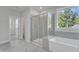 Beautiful bathroom with glass shower, soaking tub, and ceramic tile floors at 9168 Dupree Meadow Dr # 15, Angier, NC 27501