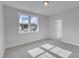 Bright bedroom with a large window, neutral carpet, and fresh, white paint at 9168 Dupree Meadow Dr # 15, Angier, NC 27501