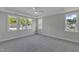 Bright bedroom with carpet, fan, tray ceiling, and large windows at 9168 Dupree Meadow Dr # 15, Angier, NC 27501