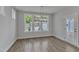Bright dining room with large windows, modern light fixture, and a view of the yard at 9168 Dupree Meadow Dr # 15, Angier, NC 27501