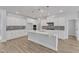 Contemporary kitchen with white cabinets, quartz countertops, and decorative backsplash at 9168 Dupree Meadow Dr # 15, Angier, NC 27501