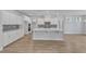 Modern kitchen with white cabinets, stainless steel appliances, and a large kitchen island at 9168 Dupree Meadow Dr # 15, Angier, NC 27501