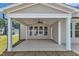 Covered patio with large windows and a ceiling fan, perfect for outdoor living and entertaining at 9168 Dupree Meadow Dr # 15, Angier, NC 27501