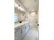 Well-lit bathroom boasting a single vanity, a shower-tub combo, and marble flooring, providing comfort and style at 960 Double Helix Rd, Apex, NC 27523