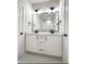 Bright bathroom featuring double sink vanity, large mirror, and modern fixtures, offering style and functionality at 960 Double Helix Rd, Apex, NC 27523
