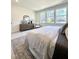 Cozy bedroom with dresser, large windows, and soft carpet at 960 Double Helix Rd, Apex, NC 27523