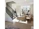 Bright dining area with wood floors and modern black staircase at 960 Double Helix Rd, Apex, NC 27523