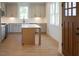 Spacious kitchen showcasing gray cabinets, stainless steel appliances, and a center island at 960 Double Helix Rd, Apex, NC 27523