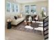 Cozy living room featuring a comfortable sofa, stylish decor, and bright natural light at 960 Double Helix Rd, Apex, NC 27523