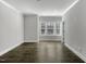 Bright living room filled with natural light, hardwood floors, and a neutral color palette at 970 Double Helix Rd, Apex, NC 27523