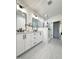 Bright main bathroom boasts double sink vanity and a glass enclosed shower at 970 Double Helix Rd, Apex, NC 27523