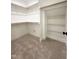 Spacious walk-in closet featuring custom shelving and ample storage for clothing and accessories at 970 Double Helix Rd, Apex, NC 27523