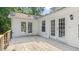 White home with a deck featuring double doors for indoor/outdoor living and great natural light at 98 Beach Ln, Henderson, NC 27537