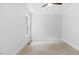 Bright bedroom features neutral walls, carpet, trim, and ceiling fan at 98 Beach Ln, Henderson, NC 27537