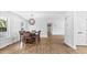 Open dining room area featuring a modern light fixture and ample natural light at 98 Beach Ln, Henderson, NC 27537