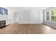 Bright living room with hardwood floors, a fireplace, and plenty of natural light at 98 Beach Ln, Henderson, NC 27537