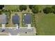 Aerial view of neighborhood homes with manicured lawns and tree-lined streets at 10 Forest Brook Way, Clayton, NC 27520