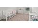 Charming Bedroom with a crib, white dresser, and changing table near a bright window at 10 Forest Brook Way, Clayton, NC 27520