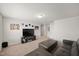 Spacious bonus room features a large television and comfortable leather seating at 10 Forest Brook Way, Clayton, NC 27520