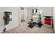Home gym with weight machine, free weights, and natural light from a window at 10 Forest Brook Way, Clayton, NC 27520