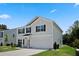 Well-maintained home features a landscaped yard and a concrete driveway leading to the garage at 10 Forest Brook Way, Clayton, NC 27520