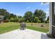 Concrete patio with fire pit and view of the backyard at 10 Forest Brook Way, Clayton, NC 27520