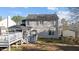 Rear exterior of home with deck, screened porch, and a spacious backyard at 1007 Olde Midway Ct, Knightdale, NC 27545