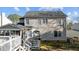 View of the home exterior, with deck, screened porch, and fenced yard at 1007 Olde Midway Ct, Knightdale, NC 27545