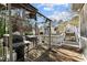 Backyard deck featuring a covered grill and stairs leading to the yard at 1007 Olde Midway Ct, Knightdale, NC 27545