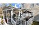 Exterior view of a deck, screened porch and ladder against home's siding at 1007 Olde Midway Ct, Knightdale, NC 27545
