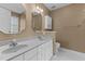 Bathroom featuring double sink vanity, mirrored wall cabinet and stylish faucets at 1007 Olde Midway Ct, Knightdale, NC 27545